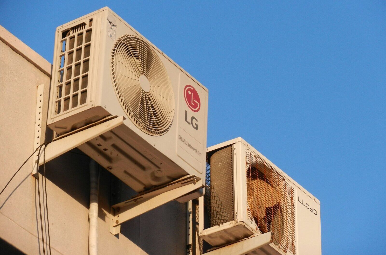 A large air conditioner mounted on the side of a building